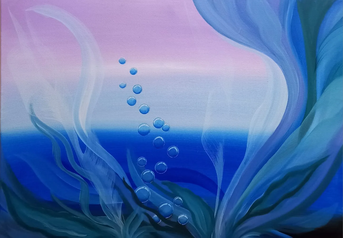 Bubbles rising through deep blue water under a pink sky