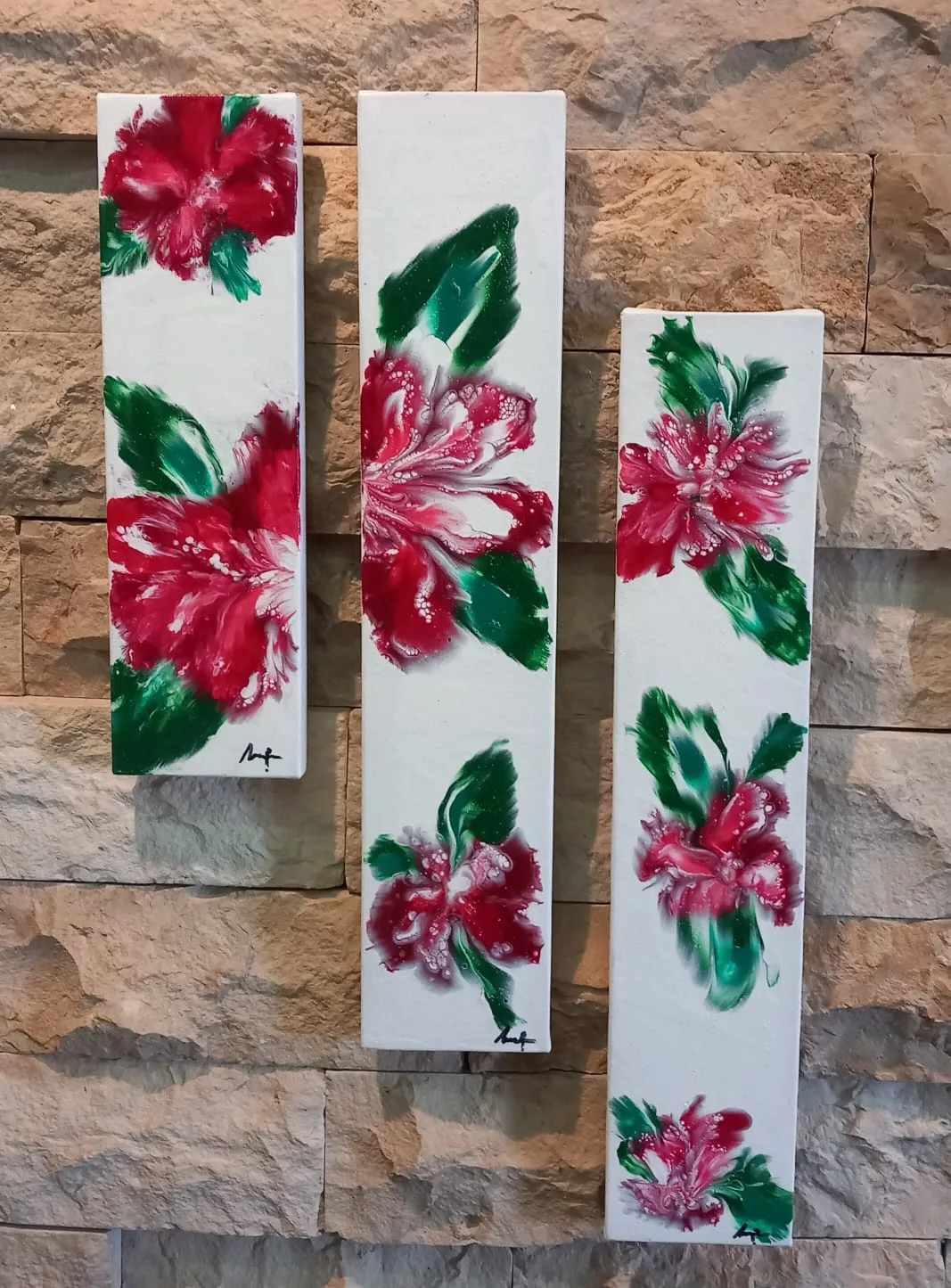 Three narrow white panels with red flowers