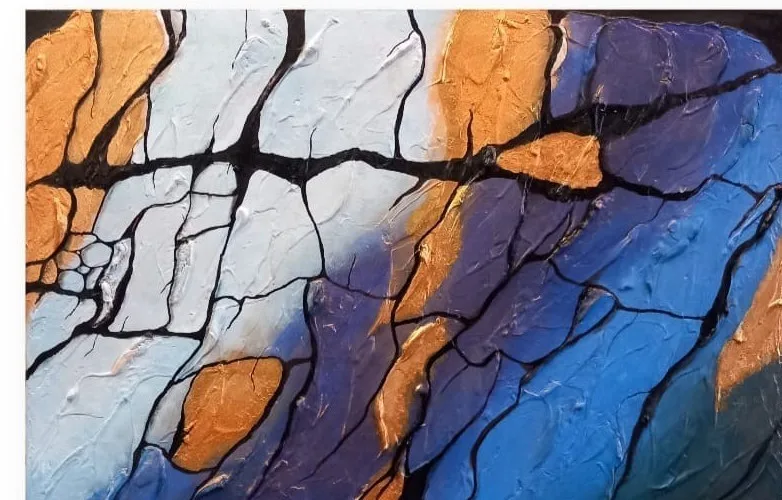 Cracked rock in blue, orange and black